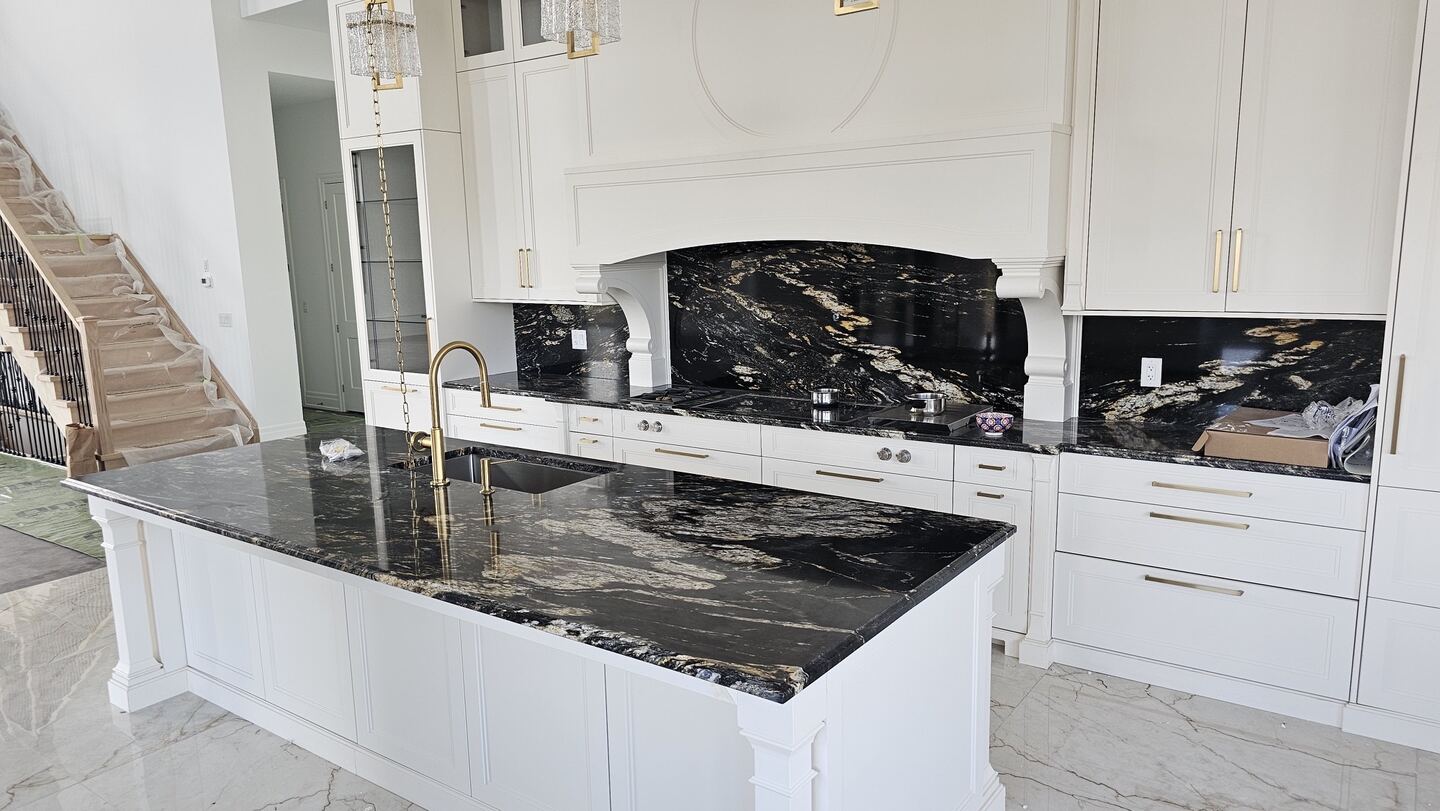 Kitchen island and countertop installation with waterfall-style stone detailing