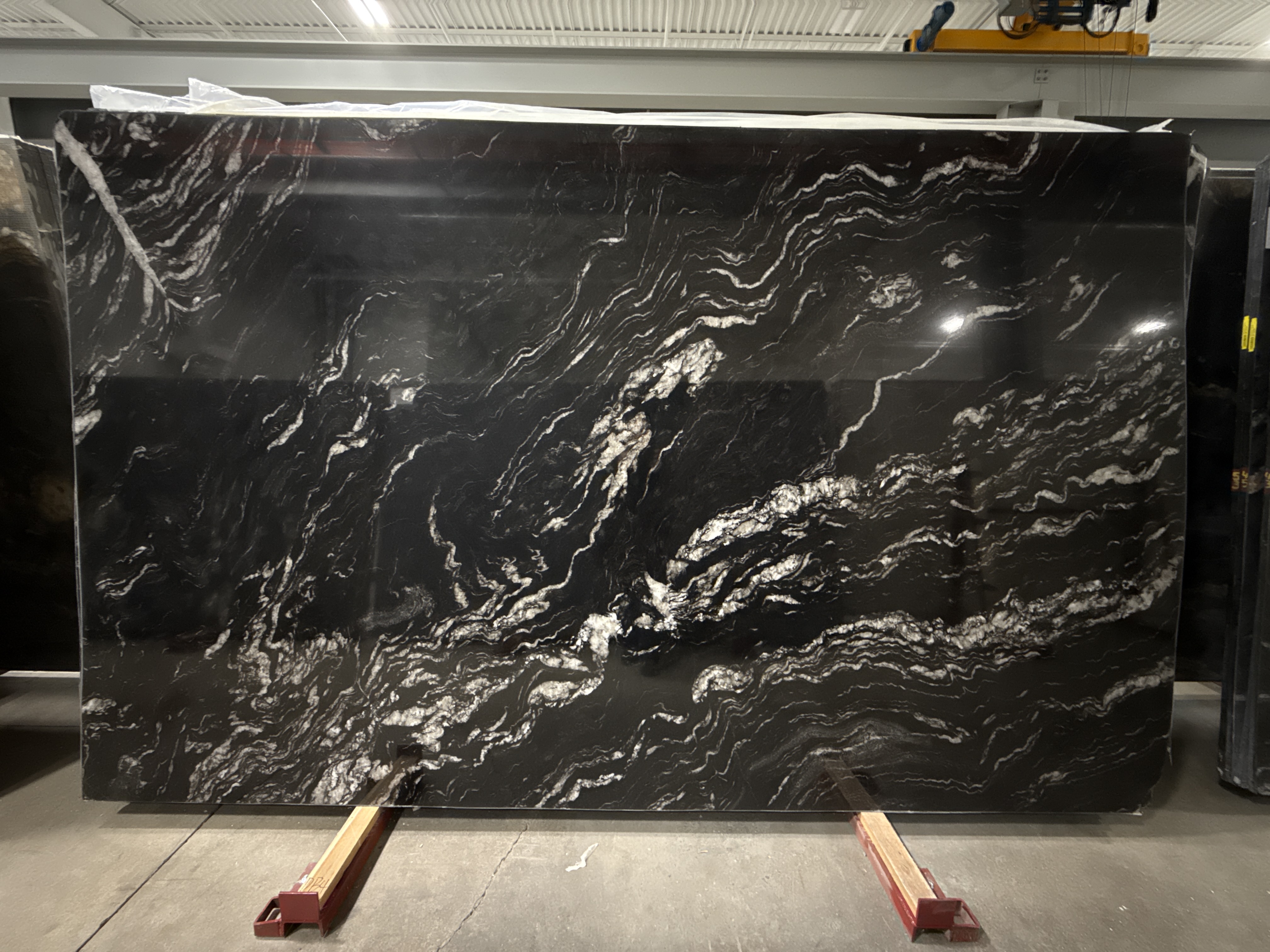 Preto Titanium granite slab standing in a stone yard